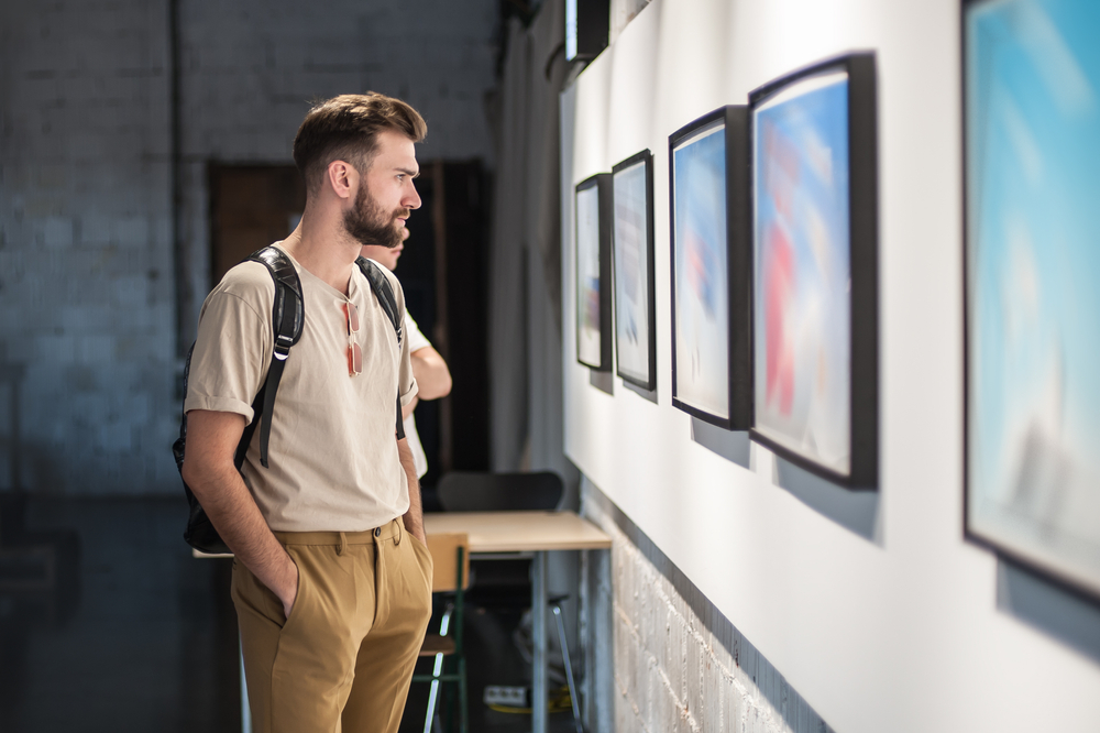 Young,Man,In,Modern,Art,Exhibition,Gallery,Hall,Contemplating,Artwork.